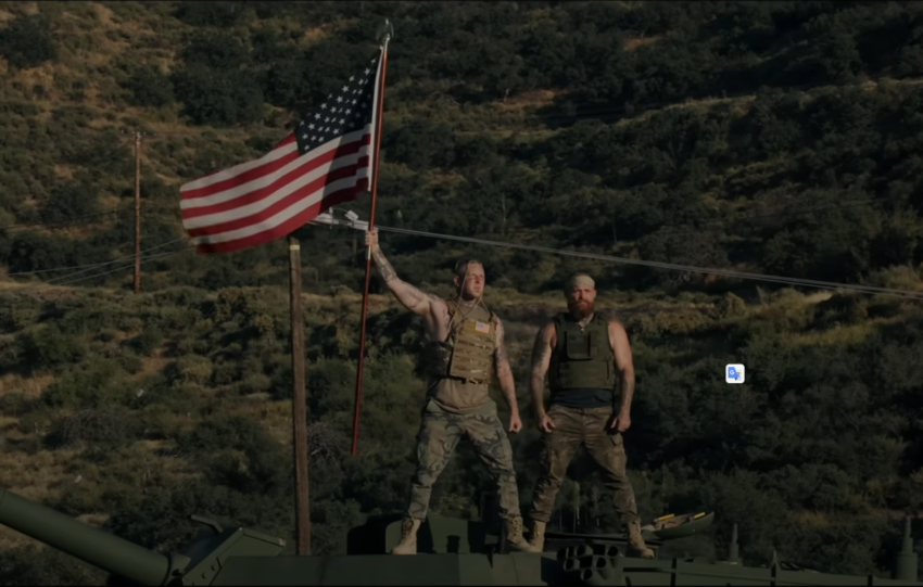 tom macdonal and adam calhoun standing on a tank with giant american flag for the American Flags music video